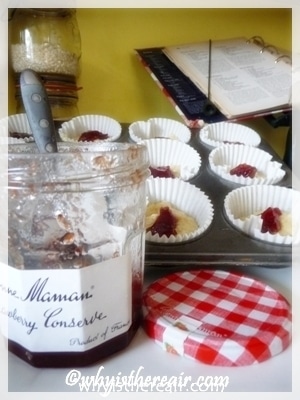 To make jam muffins, add a teaspoon of jam on top of the batter