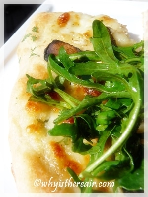 Thermomix pizza dough makes excellent white pizza with a rocket salad on top