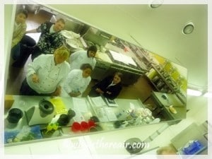 Overhead mirrors in training kitchens enable Barnfield College students to see all aspects of food prep