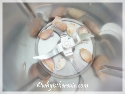 Drop unpeeled cloves of garlic into your Thermomix bowl