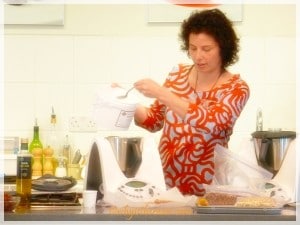 Dani adds ingredients to the Thermomix bowl