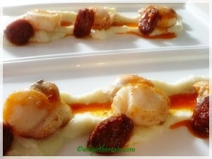 Drizzle a little of the paprika-laden oil over the scallops and cauliflower purée